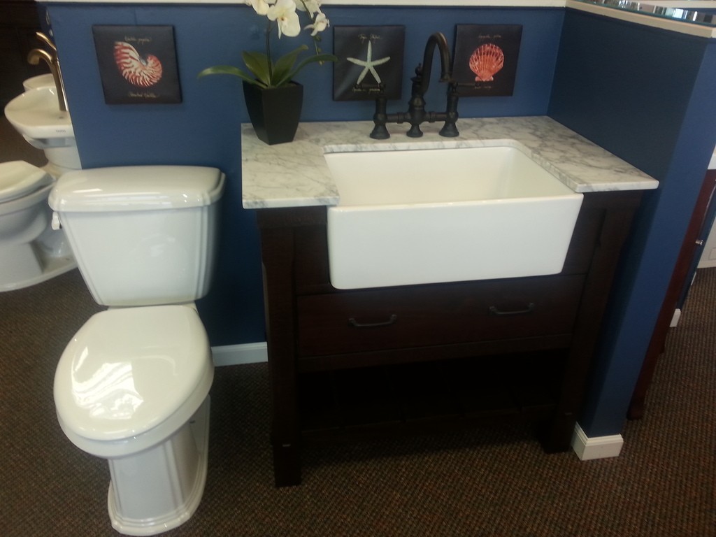 farm sink and vanity will give more countertop space in a small bathroom