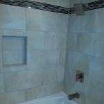 tile wall installation with a glass accent strip in Marysville, Pa