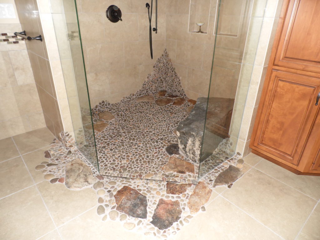 stone shower floor with river rock and pavers